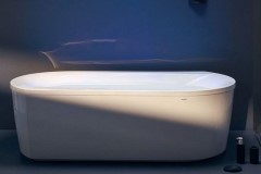 Contemporary Oval Freestanding Bath with Angled & Curving Sides